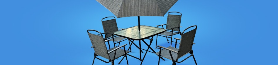 Perfect your patio with a gray wicker patio set, with two chairs, a table, and love seat with blue cushions on a blue background.
