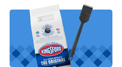 A bag of charcoal and a black spatula on a blue background. 