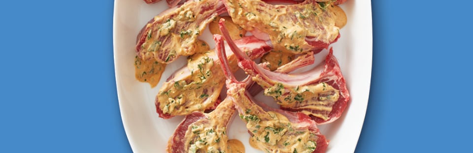 lamb chops marinating in a yogurt marinade