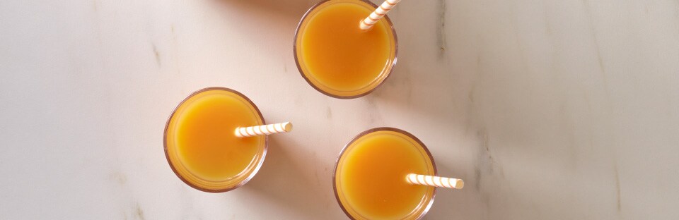 Pumpkin Juice in a pitcher and individual cups
