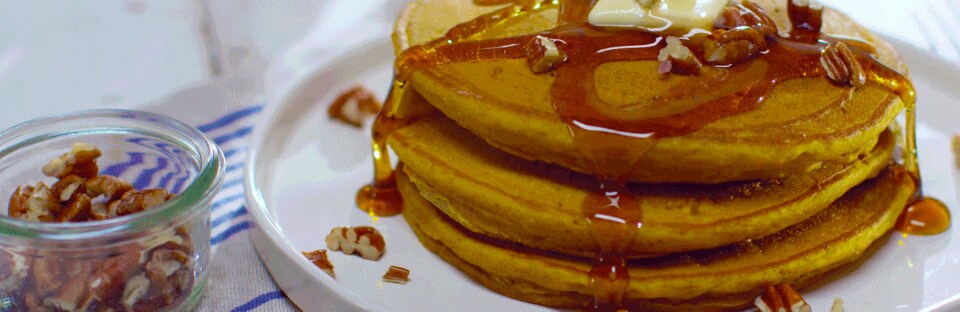 Pumpkin Pie Pancakes on a plate with pecans