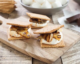 Pineapple smore on wooded board on table Pineapple smore on wooded board on table