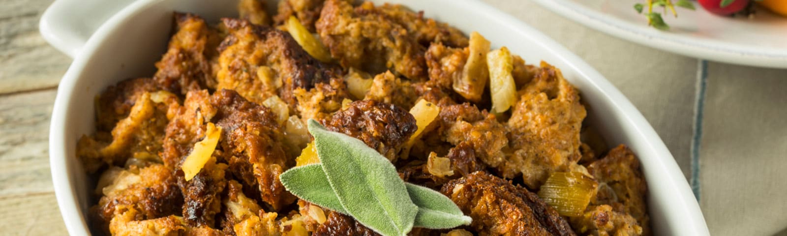 Traditional Thanksgiving stuffing in a casserole dish on a table Traditional Thanksgiving stuffing in a casserole dish on a table