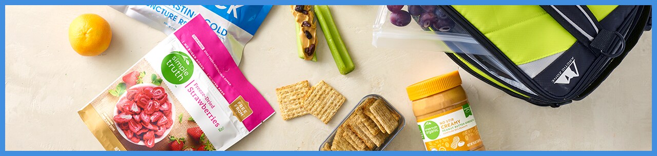 Lunchbox with snacks like crackers and peanut butter