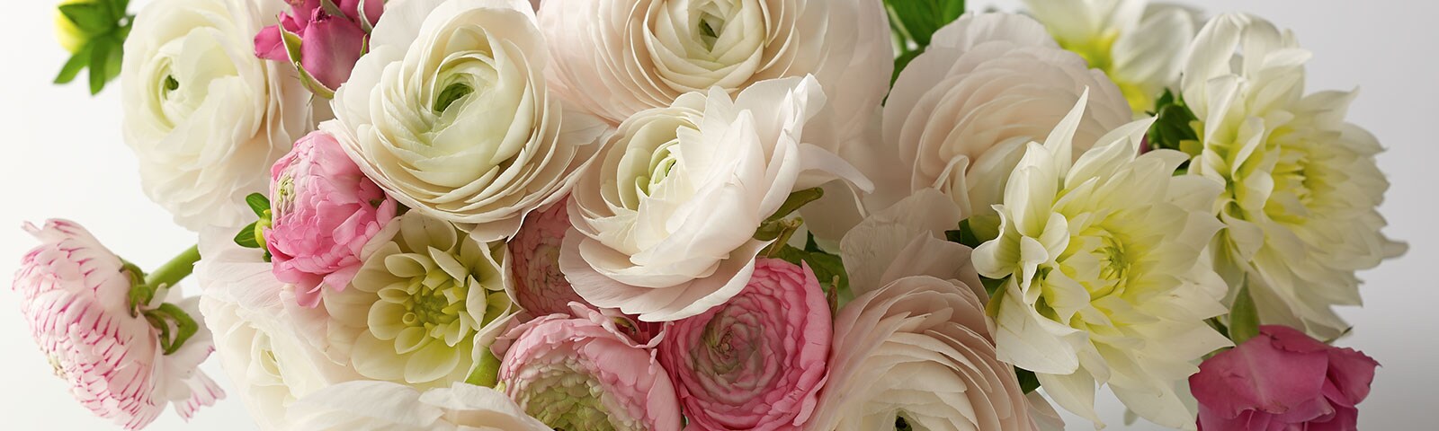 A bouquet of beautiful summer flowers with pastel colors sitting in a vase A bouquet of beautiful summer flowers with pastel colors sitting in a vase