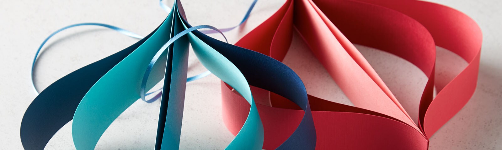 Finished blue and red oversized paper ornaments Finished blue and red oversized paper ornaments