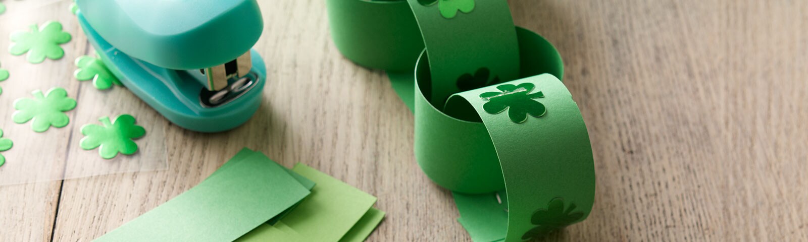 Green paper with shamrock stickers Green paper with shamrock stickers