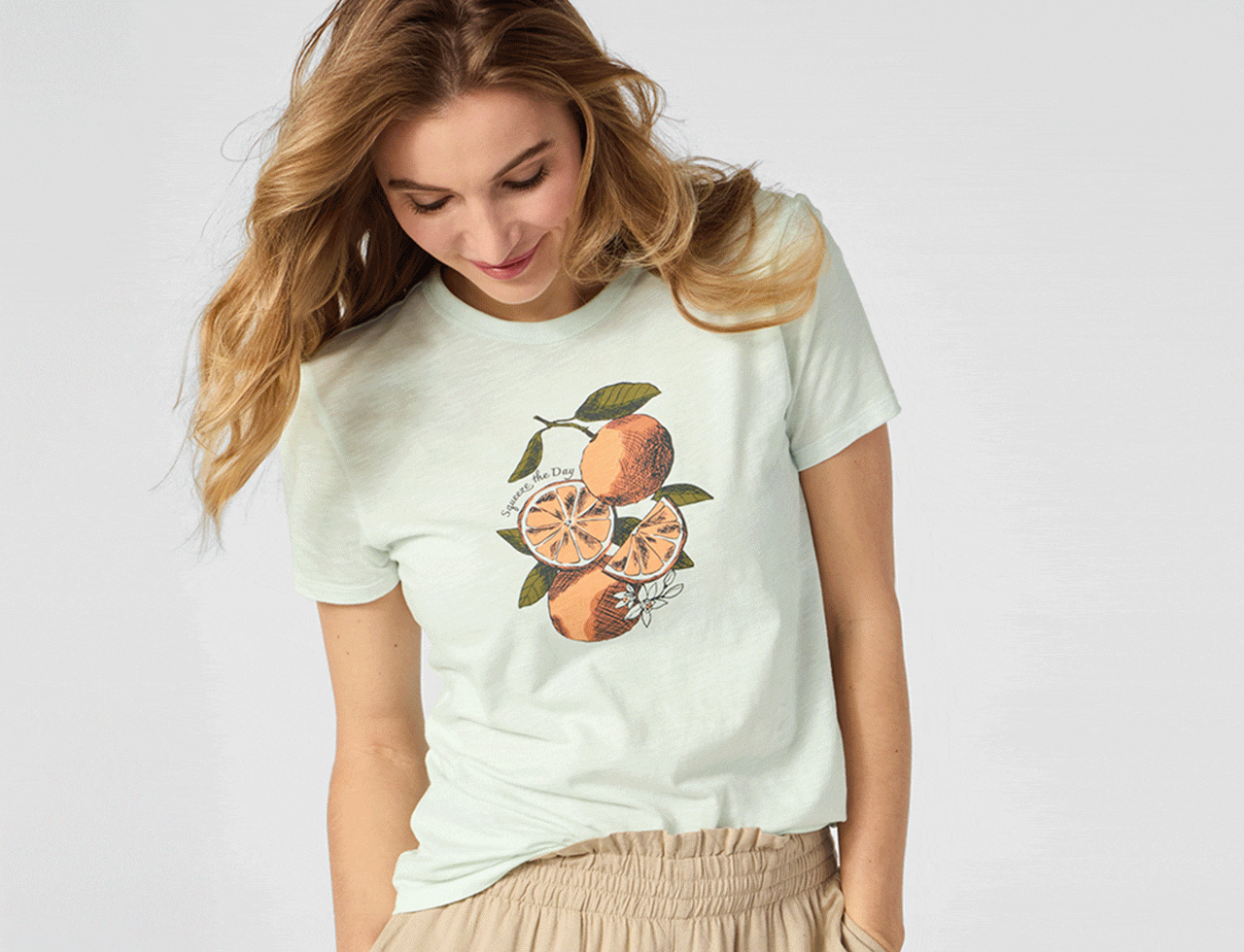 A rotating set of people, couples and singles, wearing featured clothing while smiling.